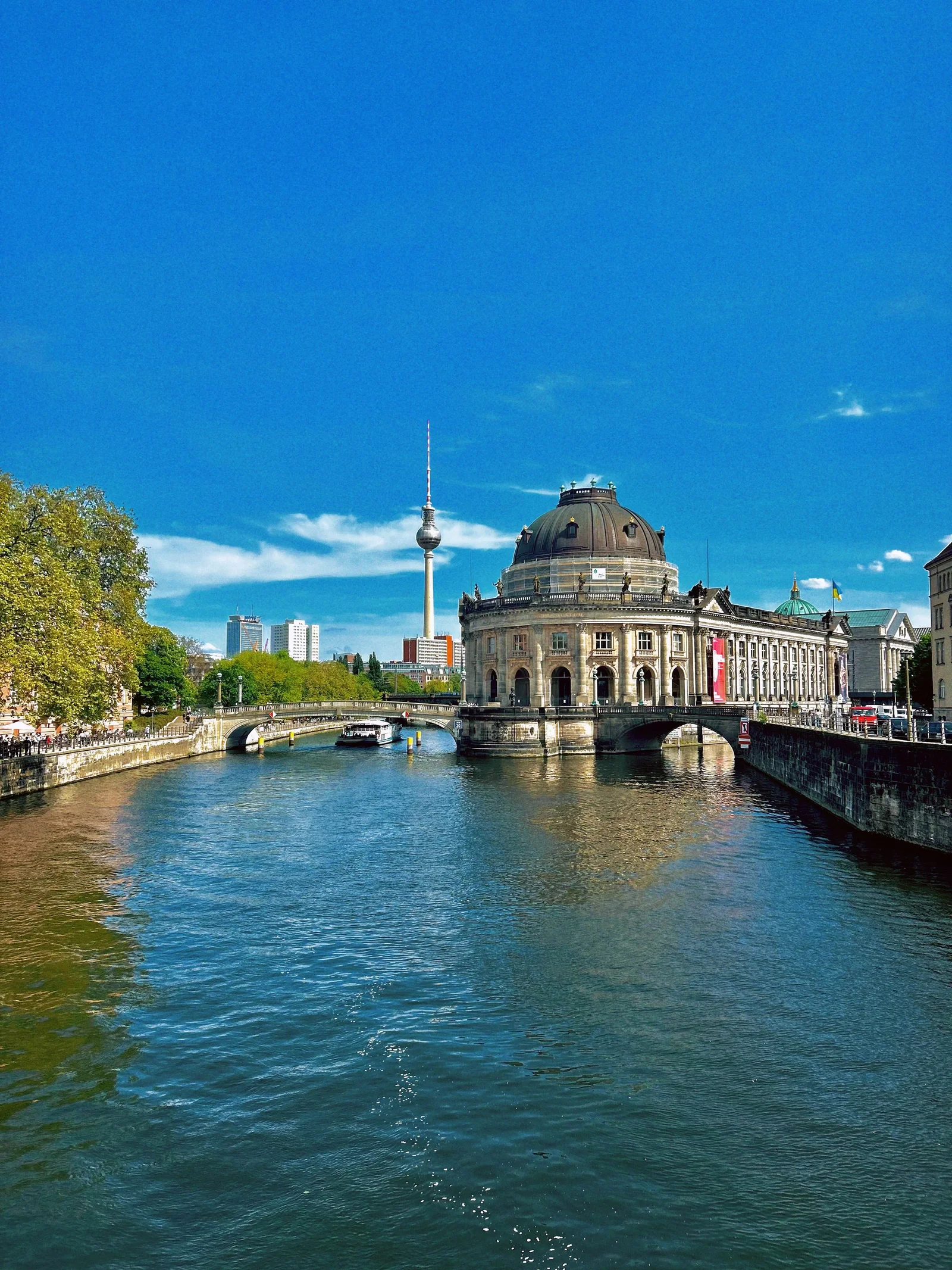 View of Munich's architectural blend with people strolling in a fall setting.