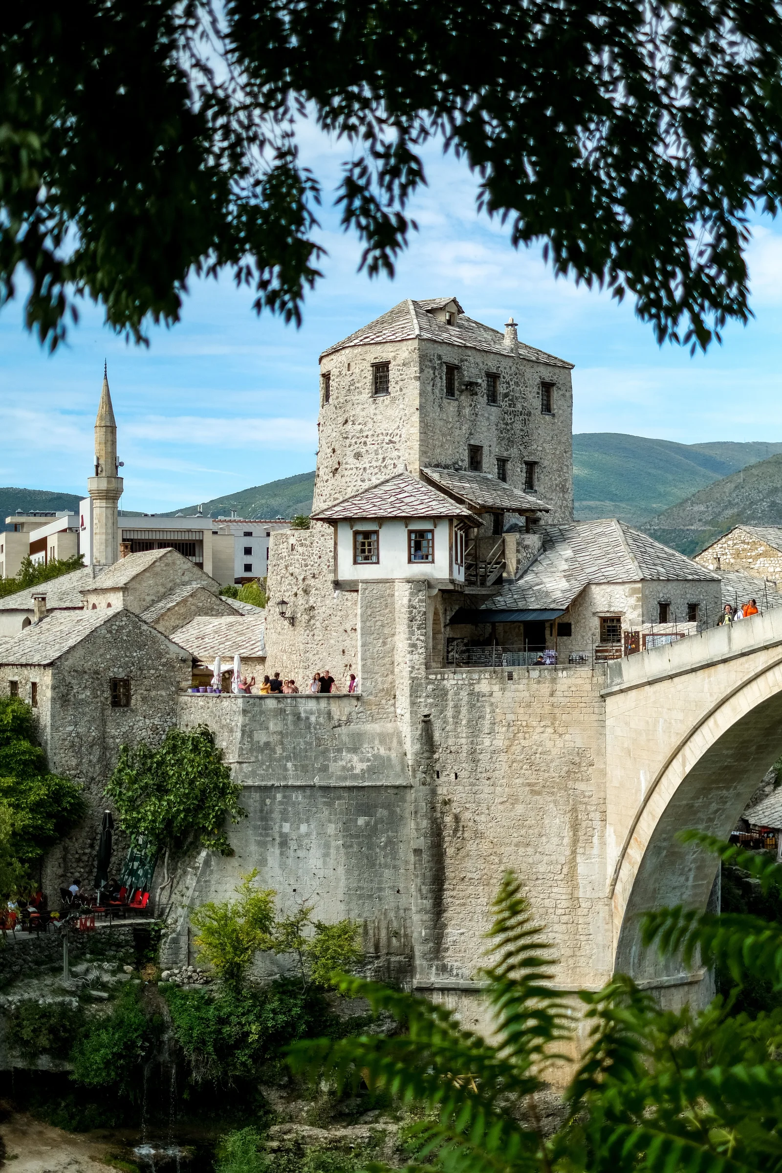 Historic view of Stari Most bridge in Mostar, showcasing Ottoman architecture over the Neretva River.