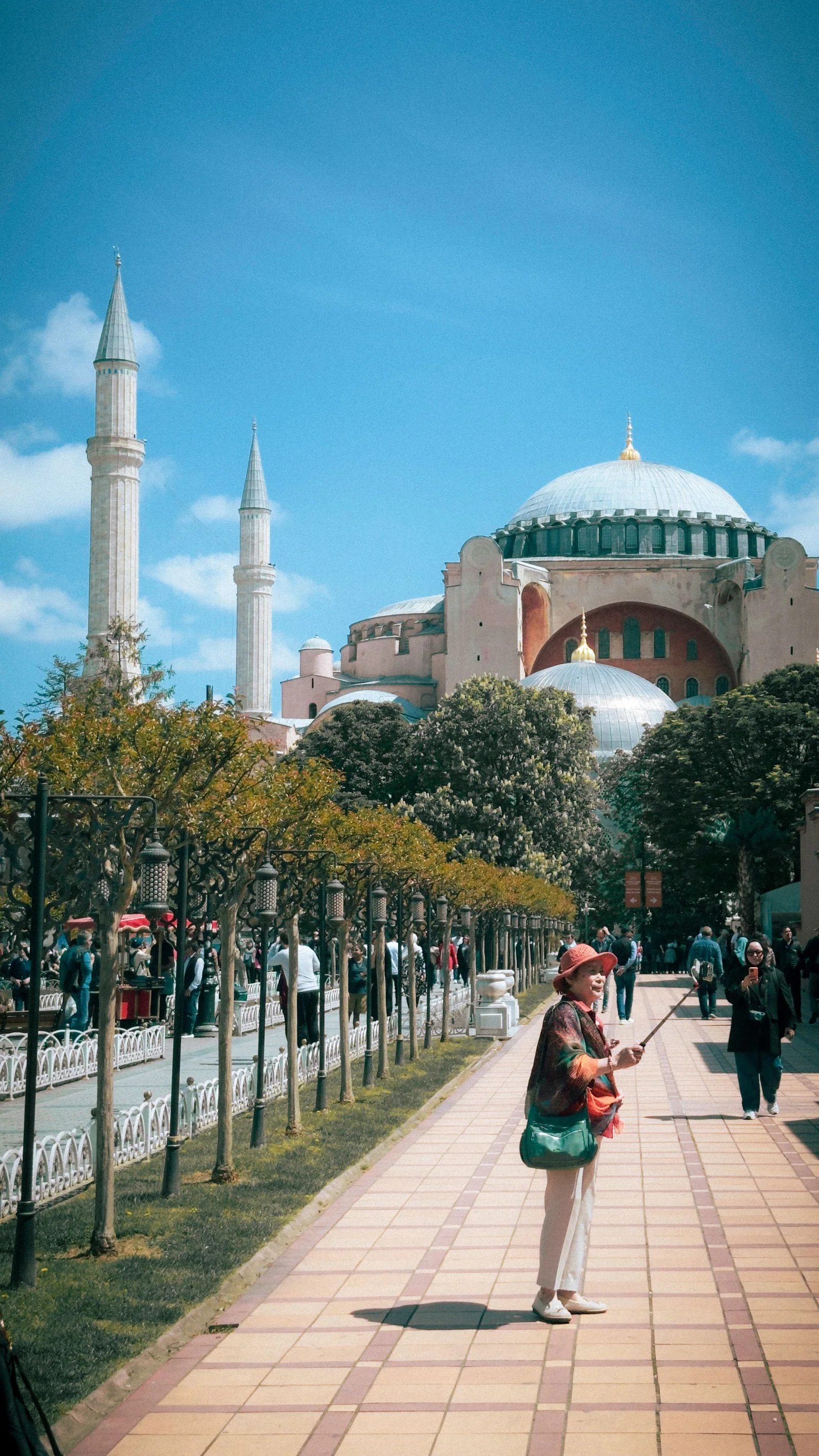 Tourists exploring the iconic Hagia Sophia in Istanbul, a blend of history and architecture.