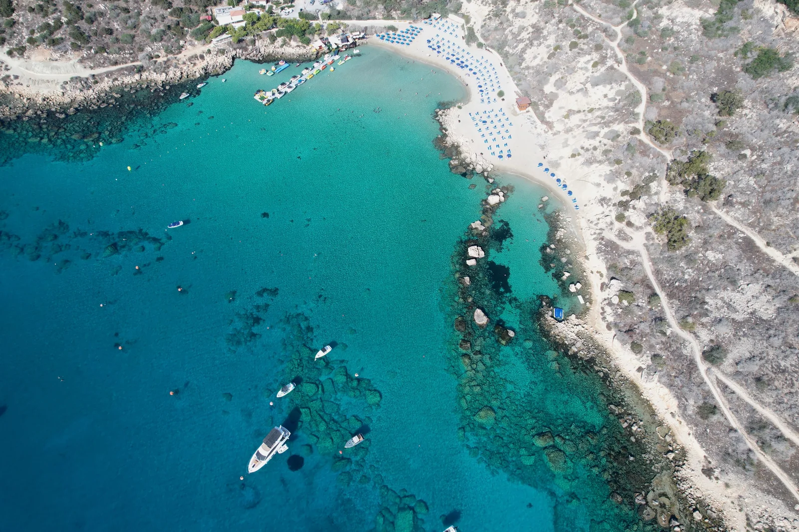 Stunning sunset view of rugged cliffs along the Mediterranean coast in Zypern, perfect for travel enthusiasts.