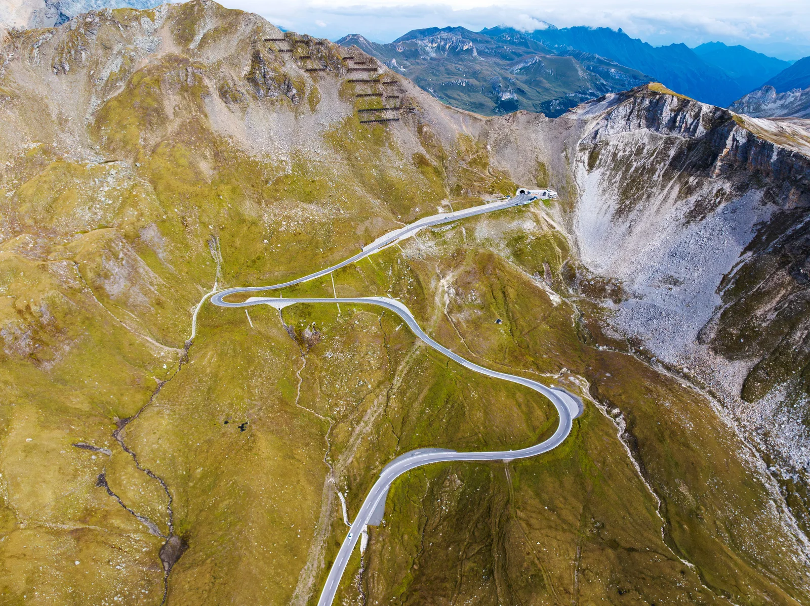 A breathtaking aerial view of a winding mountain road in Hochtor, Austria.