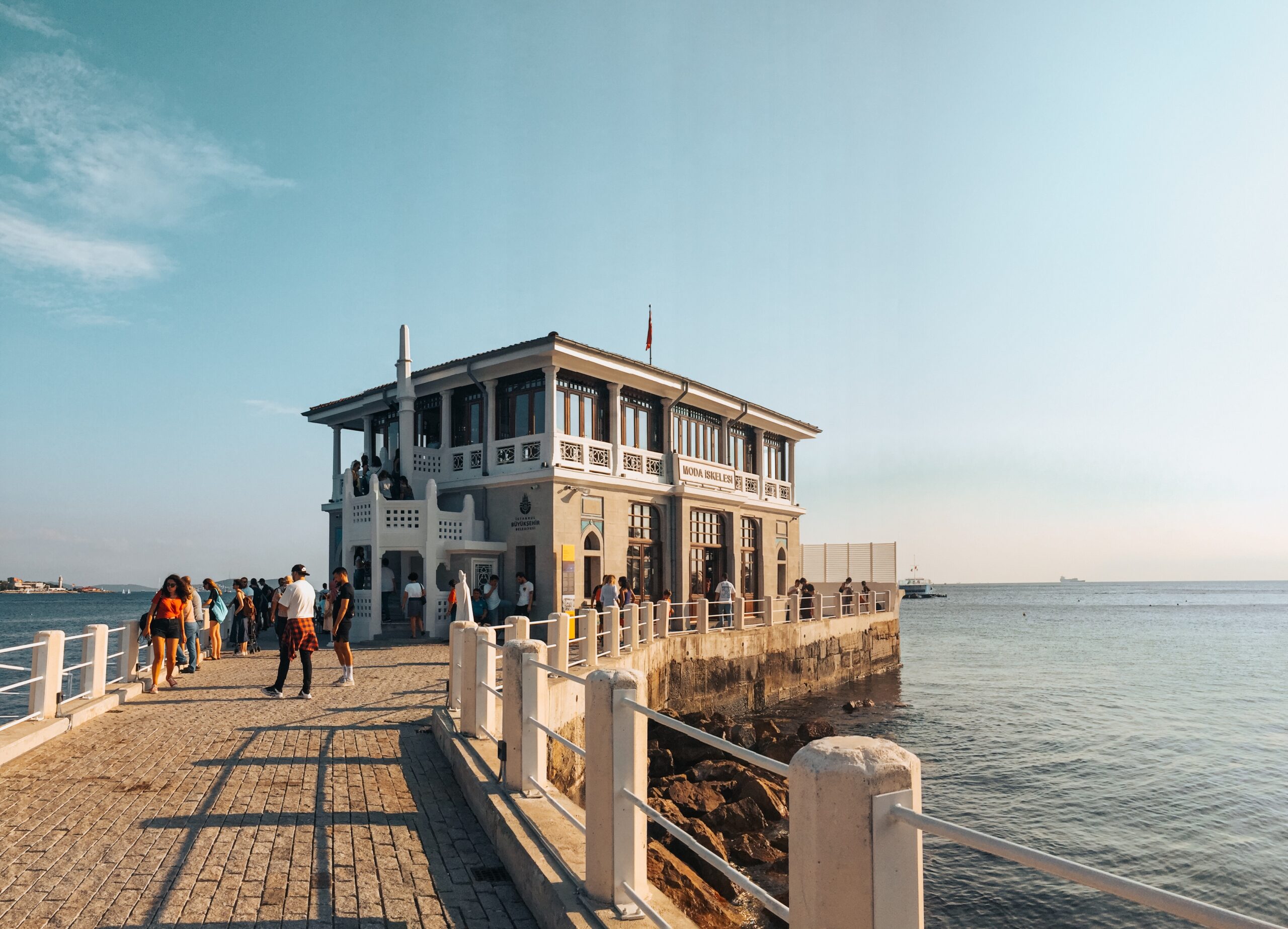 People walking on concrete bridge