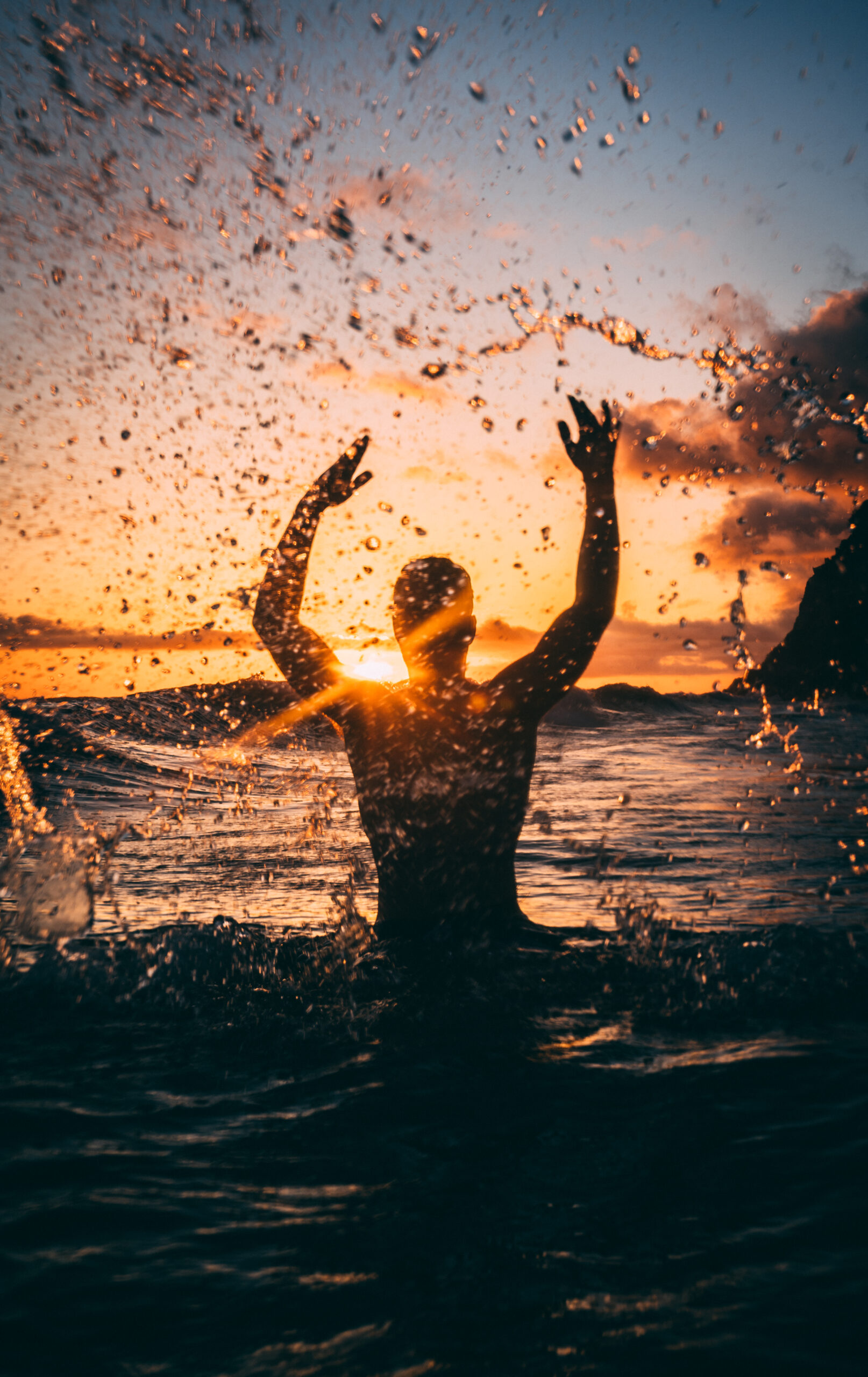 Silhouette photography of man at beach during sunset