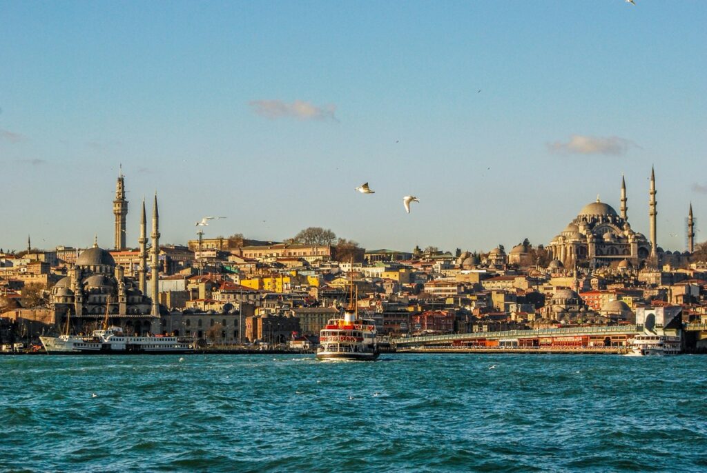 Ferry crossing Bosphorus at sunset in Istanbul.